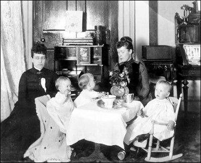 President Benjamin Harrison's grandchildren, Mary McKee, Marthena Harrison and Baby McKee, have a party in the second-floor nursery of the White House.