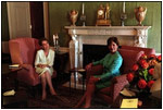 Du ring the Mexico State Visit, Laura Bush and Marta Sahagún de Fox, wife of Mexican President Vicente Fox, enjoy a quiet moment in the Green Room Sept. 5, 2001. The Green Room has provided a cozy environment for relaxed conversation over the years.