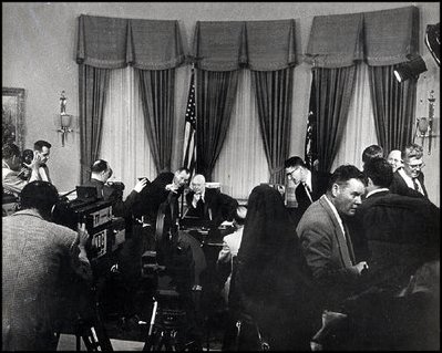 As television producers and photographers make final adjustments on camera angles and sound in the Oval Office, President Eisenhower prepares to announce his decision to run for re-election February 29, 1956.