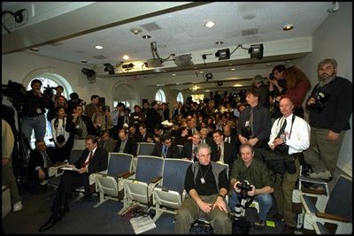 Reporters prepare for a press conference by President Bush in the James S. Brady Press Briefing Room, March 13, 2002. 