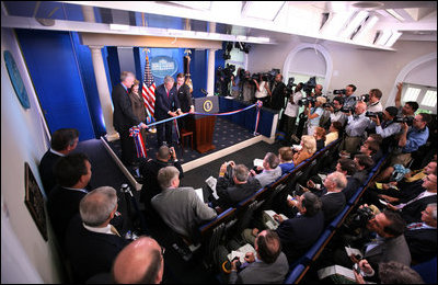 President George W. Bush and Mrs. Laura Bush participate in the ribbon-cutting ceremony to officially open the newly renovated James S. Brady Press Briefing Room Wednesday morning, July 11, 2007, at the White House.