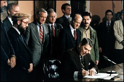President Reagan signs the proclamation for Afghanistan Day on March 20, 1987 in the Roosevelt Room, which houses the Nobel Peace Prize awarded to Teddy Roosevelt.
