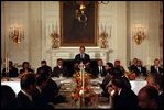 President George W. Bush addresses ambassadors and other distinguished guests during a dinner for Ramadan in the State Dining Room, Nov. 19, 2001.