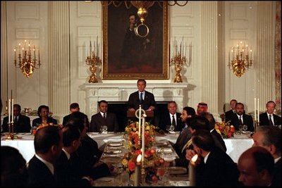 President George W. Bush addresses ambassadors and other distinguished guests during a dinner for Ramadan in the State Dining Room, Nov. 19, 2001. 