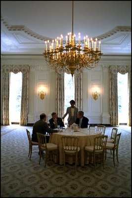 President George W. Bush meets with Chief of Staff Andy Card, National Security Adviser Condoleezza Rice and Press Secretary Ari Fleischer in the State Dining Room before a luncheon in the Blue Room May 2, 2002. Thomas Jefferson used the State Dining Room as his office.