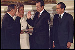 Appointed by then-President Richard Nixon, future President George H.W. Bush is sworn-in as U.S. Representative to the United Nations in the State Dining Room February 26, 1971.