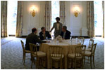 President George W. Bush meets with Chief of Staff Andy Card, National Security Adviser Condoleezza Rice and Press Secretary Ari Fleischer in the State Dining Room before a luncheon in the Blue Room May 2, 2002. Thomas Jefferson used the State Dining Room as his office. 