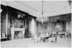 President Theodore Roosevelt's State Dining Room was baronial style and featured stuffed moose and elk heads on the walls. In contrast, the first cabinet dinner in this room on Dec. 18, 1902 featured pink roses and candles.