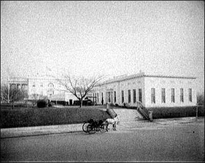 Roosevelt's temporary office building was built on the west side of the White House. This one-story structure housed the President's office, the Cabinet Room and other offices. Today this building is known as the West Wing.