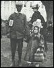 A young girl and her escort pose on the South grounds of the White House on Easter Monday, 1889.