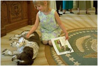 Spot makes a new friend in the Oval Office, April 3, 2002.