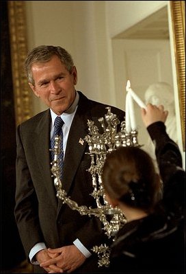 "Tonight, for the first time in American history, the Hanukkah menorah will be lit at the White House residence," said President George W. Bush at the ceremony in which 8-year-old Talia Lefkowitz helps in lighting the menorah Dec. 10, 2001.