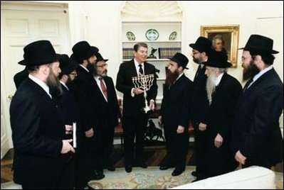 President Reagan receives a menorah in the Oval Office from "Friends of Lubavitch" in 1986. 
