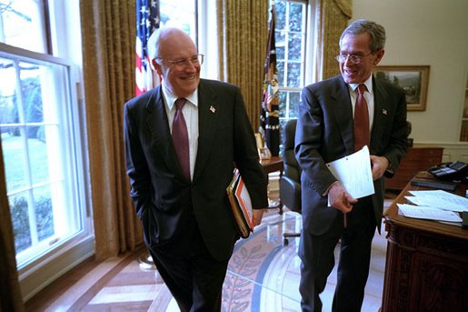 Vice President Dick Cheney and President George W. Bush joke with each other after a meeting in the Oval Office Jan. 24, 2002. White House photo by David Bohrer.