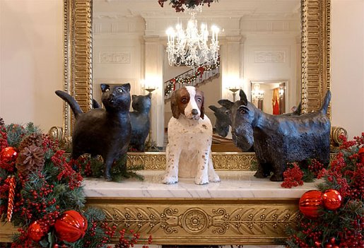 Adorning the Entry Hall mantel are the pets of President George W. Bush and Laura Bush. The Bushes' cat, India "Willie" Bush, and Spot, their English Springer Spaniel, have been part of the Bush pet clan for more than a decade. Barney Bush, a Scottish terrier, was a birthday gift from the President to Mrs. Bush in 2000. White House photo by Tina Hager.
