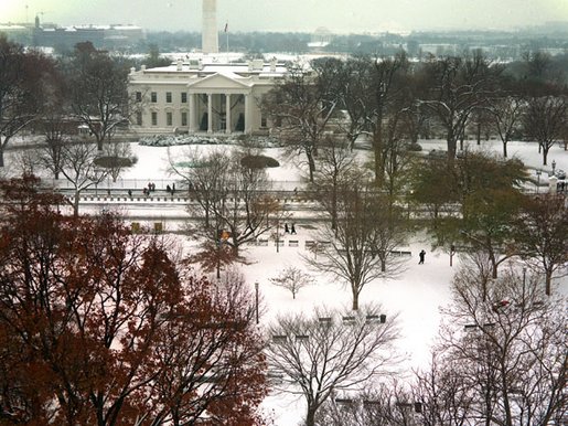 An early winter snow transforms the White House and Lafayette Park into a winter wonderland, Thursday, Dec. 5, 2002. White House photo by Paul Morse.