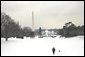 The President takes a walk in the snow on the South Lawn with his dog, Spot, Thursday, Dec. 5, 2002. White House photo by Eric Draper.