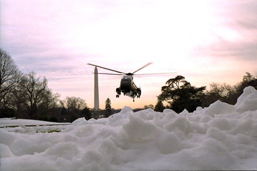 Marine One arrives from Camp David and lands on the South Lawn in an area cleared of snow, Sunday, Dec. 8, 2002. White House photo by Tina Hager.