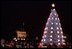 Leading the 2001 Christmas Pageant of Peace program, President George W. Bush and Mrs. Laura Bush preside over the lighting ceremonies for the National Christmas Tree, a 40-foot Colorado blue spruce. 