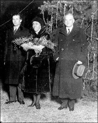 President Hoover and Mrs. Hoover pose in front of the 1930 National Community Christmas Tree. 