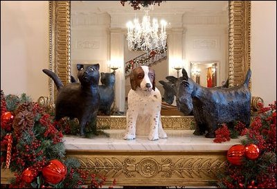 Adorning the Entry Hall mantel are the pets of President George W. Bush and Laura Bush. The Bushes' cat, India "Willie" Bush, and Spot, their English Springer Spaniel, have been part of the Bush pet clan for more than a decade. Barney Bush, a Scottish terrier, was a birthday gift from the President to Mrs. Bush in 2000.