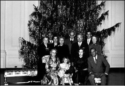 President Truman and his family took a picture in front of the White House Christmas Tree in 1947. The following year, the White House interior was undecorated because of the home was undergoing a much-needed remodeling. The President and Mrs. Truman took up residence at the Blair House across the street from the White House.
