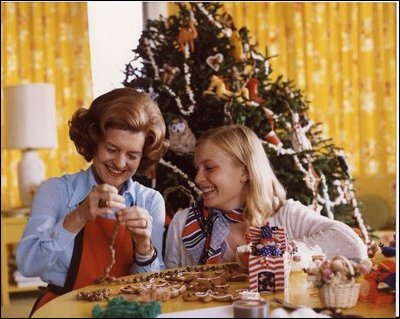 First Lady Betty Ford and her daughter Susan making Christmas garlands.