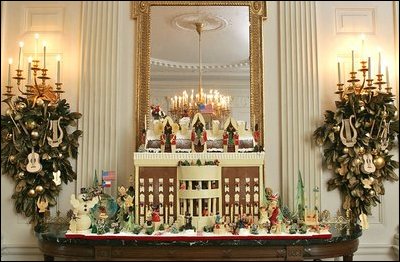 The Gingerbread House sits on a buffet in the State Dining Room. This year's Gingerbread House is made from 100 pounds of gingerbread and 150 pounds of chocolate.