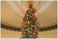 The Official 2004 Christmas tree stands in the center of the Blue Room. The Christmas tree this year is an 18-foot Noble fir. The tree was donated by John and Carol Tillman of Rochester, Wash.