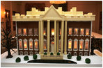 The White House gingerbread house, created by White House Executive Pastry Chef Thaddeus DuBois, is seen on display in the State Dining Room. 