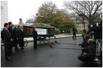 Laura Bush welcomes the arrival of the official White House Christmas tree delivered Monday, Nov. 28, 2005 on a horse drawn wagon. This year's tree, which will be displayed in the Blue Room of the White House, was donated by the Deal Family of Laurel Springs, N.C.