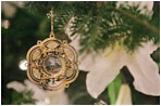The 2005 White House Christmas ornament is seen hanging Wednesday, Nov. 30, 2005 on the White House Christmas Tree, a Fraser Fir, in the Blue Room of the White House.