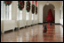 Miss Beazley makes a dash down the East Wing Colonnade, with Barney following behind, to see what Christmas decorations are on this side of the White House, Wednesday, Nov. 29, 2006.