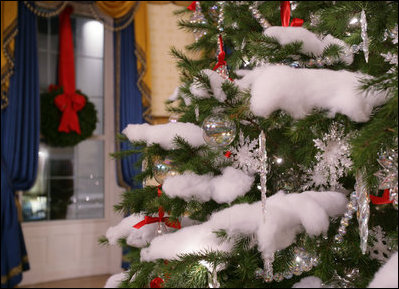 Crystal ornaments, red ribbons and make-believe snow decorate the official White House Christmas tree in the Blue Room of the White House, Wednesday, Nov. 29, 2006, an 18-foot Douglas fir tree donated by the Crystal Springs Tree Farm of Lehighton, Pa. 