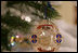 A White House Christmas ornament hangs from a branch on the official White House Christmas tree Wednesday, Nov. 29, 2006, an 18-foot Douglas fir on display in the Blue Room of the White House. 