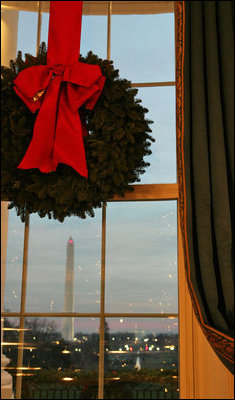 As twilight falls over Washington, D.C., the decorations in the Blue Room remain ever bright.
