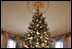 This year’s official White House Christmas Tree is a Douglas Fir donated by the Botek family, owners of The Crystal Spring Tree Farm in Lehighton, Pa. The 18-foot, 6-inch tree stretches from floor to ceiling in the Blue Room. The branches are topped with snow, accented with red ribbons and decorated with crystals and iridescent glass ornaments.