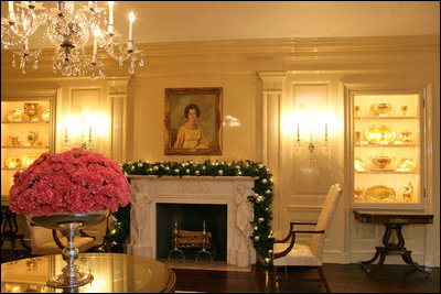 Silver glass ornaments were chosen to decorate the mantle to keep in the Vermeil Room. Carnations bloom in vermeil containers throughout the room and atop the tables.