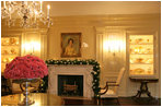 Silver glass ornaments were chosen to decorate the mantle to keep in the Vermeil Room. Carnations bloom in vermeil containers throughout the room and atop the tables.