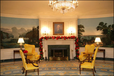 Evergreen garland is draped across the fireplace mantle in the Diplomatic Reception Room.