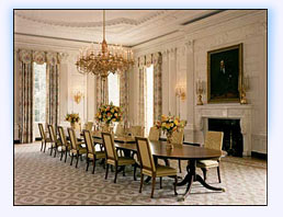 The State Dining Room features a mahogany dining table surrounded by Queen Anne-style chairs.