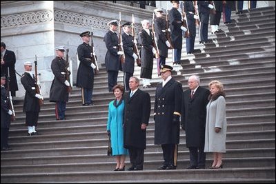 President George W. Bush, Laura Bush, Vice President Dick Cheney, and Lynne Cheney review the troops following the inauguration from the east steps of the U.S. Capitol, Jan. 20, 2001.