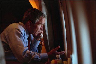 After departing Offutt Air Force Base in Bellevue, Neb., President George W. Bush confers with Vice President Dick Cheney from Air Force One during his flight to Andrews Air Force Base Sept. 11, 2001.