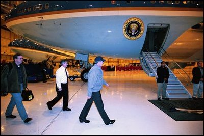 President George W. Bush leaves for a secret mission to visit troops in Baghdad, Iraq, Nov. 26, 2003. President Bush is accompanied by Communications Director Dan Bartlett, far left, and Chief of Staff Andrew Card.