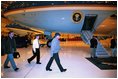 President George W. Bush leaves for a secret mission to visit troops in Baghdad, Iraq, Nov. 26, 2003. President Bush is accompanied by Communications Director Dan Bartlett, far left, and Chief of Staff Andrew Card.