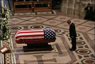 President George W. Bush bows at the casket of former President Ronald Reagan after giving an eulogy at the funeral service for President Ronald Reagan at the National Cathedral in Washington, D.C., June 11, 2004.
