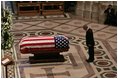 President George W. Bush bows at the casket of former President Ronald Reagan after giving an eulogy at the funeral service for President Ronald Reagan at the National Cathedral in Washington, D.C., June 11, 2004.