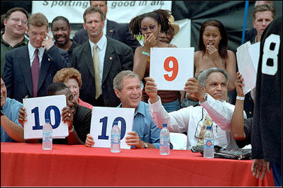 President Bush and Mayor Street help judge a contest at an urban block party in Philadelphia's downtown July 4, 2001.