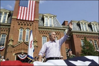 President George W. Bush waves to the estimated 3,000 people in attendance at an Independence Day celebration Monday, July 4, 2005, at West Virginia University in Morgantown. Said the President, "The history we celebrate today is a testament to the power of freedom to lift up a whole nation."