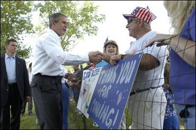President George W. Bush greets residents of Ripley, West Virginia moments after his arrival on Marine One, July 4. 